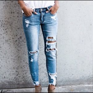 Distressed skinny ankle jeans in light wash